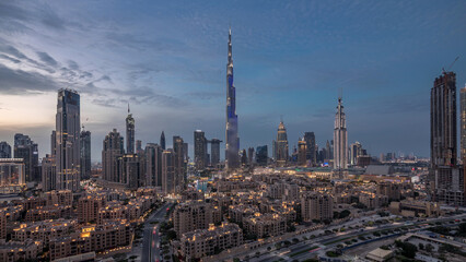 Dubai Downtown skyline day to night timelapse with Burj Khalifa and other towers panoramic view...