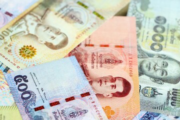 Thai baht currency money bills. The current banknotes lies on table in big amount close up