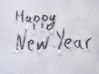 Inscription Happy New Year on snowy winter background