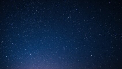 Naklejka premium Showing star-filled night sky over remote horizon, revealing Milky Way band and bright star left