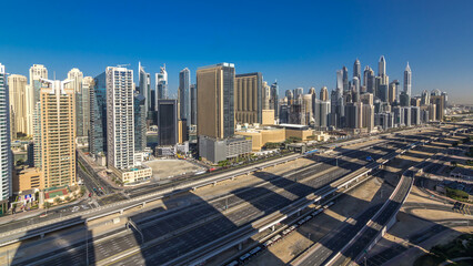 Dubai Marina skyscrapers aerial top view at morning from JLT in Dubai timelapse, UAE.