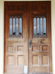 old wooden doors with decorative windows
