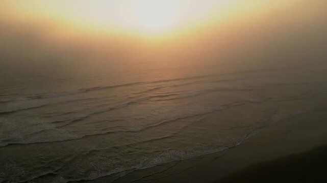 Aerial Summer Sunset at Puerto Eten, Chiclayo, Lambayeque, Golden Sandy Beach and Calm Pacific Ocean, Ideal Tropical Coastal Destination