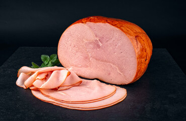 Traditional Italian prosciutto arrosto rustico - cooked roasted smoked ham hounch meat cut in this slices