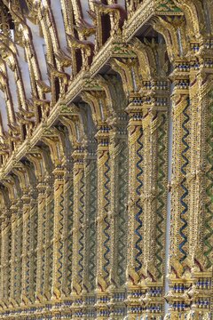 Columns with mosaic decorations (Lai Kranok), also: golden, mosaic-decorated Thai temple columns (Sao), decorated in the Lai Kranok style, typical of Rattanakosin architecture (Bangkok style), on the outer fa&ccedil;ade of the Ubosot (ordination hall), Wat Chana Songkhram, Phra Nakhon, Bangkok, Thailand