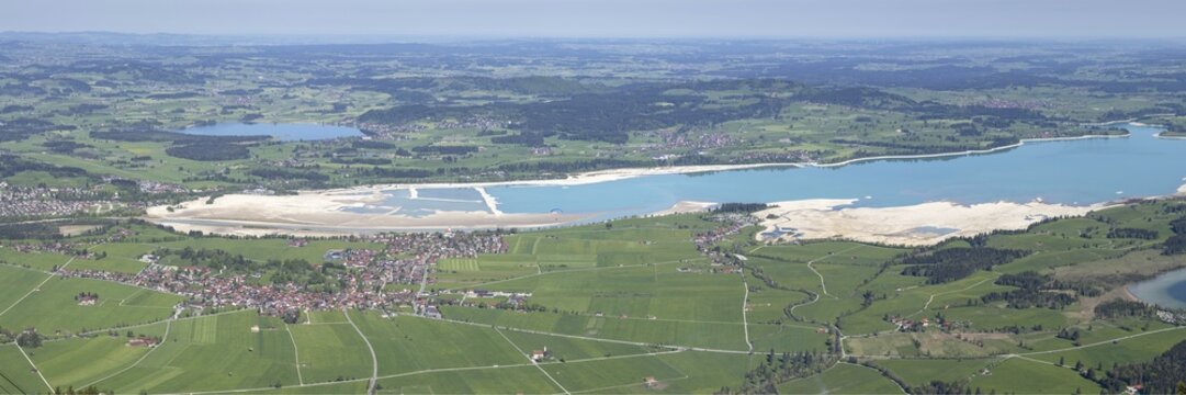 Panorama in spring from Tegelberg, 1881m, of Schwangau, Waltenhofen, Hopfensee and the partly still drained Forggensee, Ostallg&auml;u, Bavaria, Germany