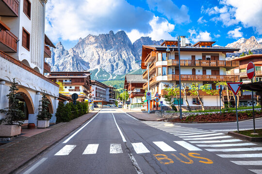 Alpine town of Cortina D Ampezzo street and Alps peaks view