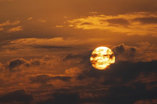 Dramatic sunset with clouds and sun, Etosha National Park, Namibia