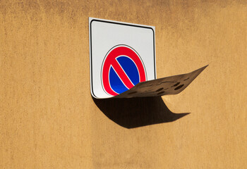  damaged  No Parking sign on wall