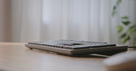 Black Keyboard on Wooden Desk Closeup View