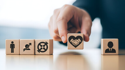 Businessman placing heart symbol block with handshake