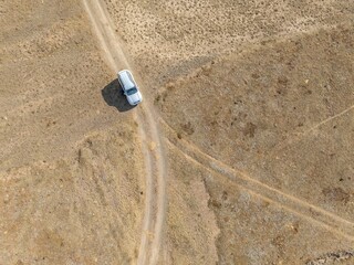 Aerial view, Vast empty landscape, Road and off-road vehicle, Top down view, Two paths divide, Symbolic for decisions, Moldo Too mountains, Naryn region, Kyrgyzstan