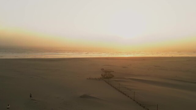 Aerial Summer Sunset at Puerto Eten, Chiclayo, Lambayeque, Golden Sandy Beach and Calm Pacific Ocean, Ideal Tropical Coastal Destination