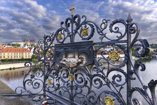 Bronze relief, Saint Nepomuk falling over the bridge, laying hands on the relief is said to bring good luck, Charles Bridge, Prague, Bohemia, Czech Republic