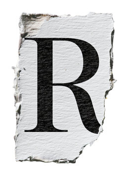 Uppercase letter R on white torn paper