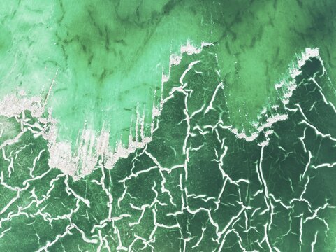 Detail of a toxic phosphogypsum waste pond in the vicinity of the town of Huelva. Aerial view. Drone shot. Huelva province, Andalusia, Spain