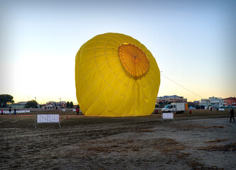 Landscape with the preparation and inflation of a hot air balloon
