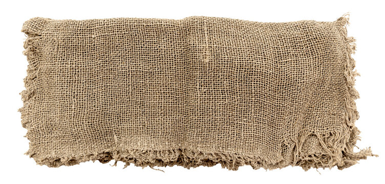 Burlap texture. A piece of torn burlap on a white background. Canvas. Packing material