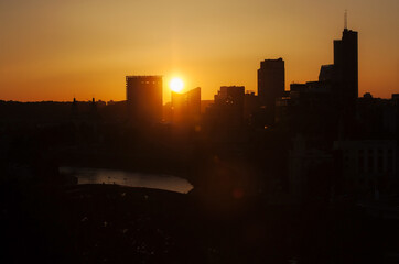 A warm summer sunset over Vilnius, the capital of Lithuania. The view from Gediminas Tower of the modern monolithic buildings on the right bank of the Neris River.