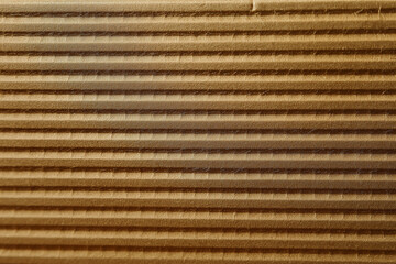 This image features a textured golden surface with parallel lines, creating an abstract visual representation of warmth, elegance, and harmony in design.