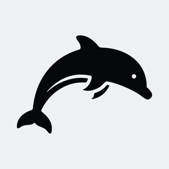 Obraz premium Simplified dolphin leaping in black and white animal silhouette vector illustration