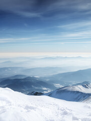 Snow Covered Mountain Landscape Under Clear Blue Sky on a Bright Day