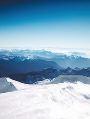 Snow Covered Mountain Landscape Under Clear Blue Sky on a Bright Day