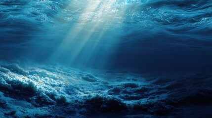 Naklejka premium an underwater scene with sunlight filtering through from above, illuminating the deep blue water and creating rays of light