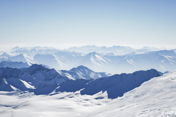 Snow Covered Mountain Landscape Under Clear Blue Sky on a Bright Day