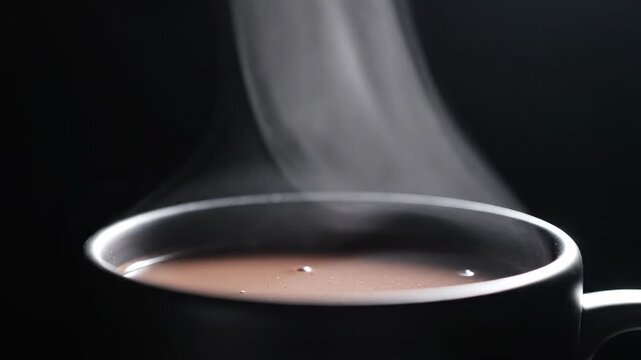 Steaming Hot Chocolate in a Dark Mug with Rising Vapor