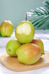 Fresh Green Pears on Wooden Board with Tropical Styling
