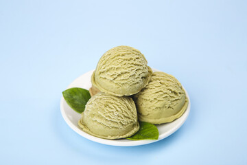 Fototapeta premium Matcha Green Tea Ice Cream Scoops with Mint Leaves
