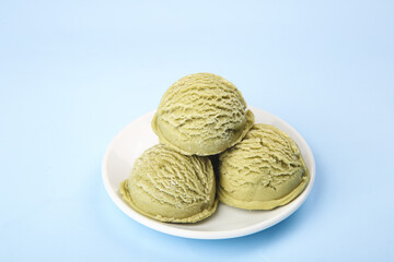 Fototapeta premium Matcha Green Tea Ice Cream Scoops on White Plate