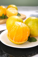 Fresh Peeled Yellow Citrus Fruit with Juicy Flesh