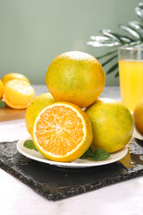 Fresh Yellow Oranges with Cut Flesh and Citrus Juice