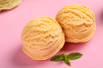 Peach Ice Cream Scoops in Waffle Cones with Mint on Pink