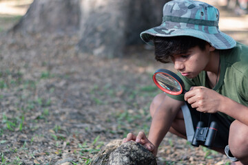 A curious mind exploring tiny details, discovering wonders through a magnifying glass.