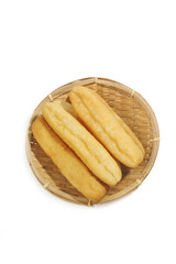 Crispy Golden Fritters in Bamboo Basket for Traditional Breakfast