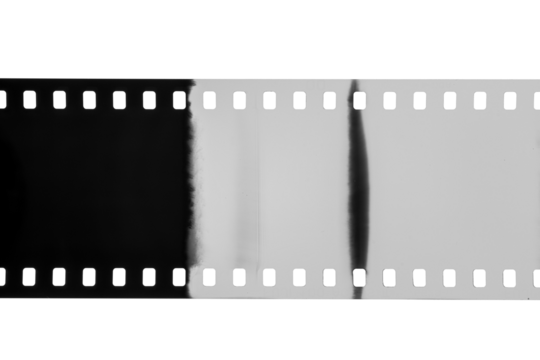 A vintage 35mm photographic film negative with abstract light leaks and sprocket holes, isolated. Copy space. Transparent PNG image. - Powered by Adobe