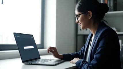Professional Woman Enabling Encrypted Cloud Backup on Laptop in Modern Office - Powered by Adobe