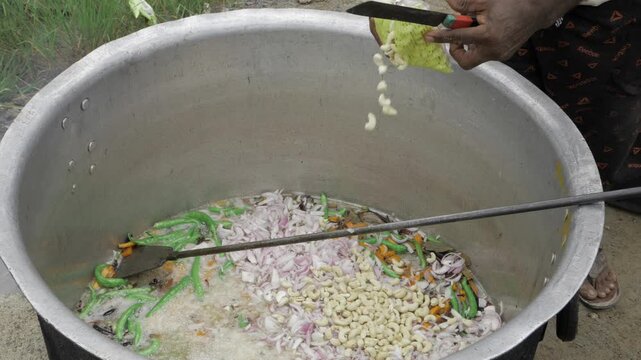 Hand Stirring Vegetables in a Pot