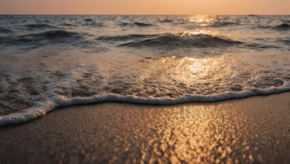 Fototapeta premium Golden Hour Serenity - Gentle Waves Washing Ashore at Sunset.
