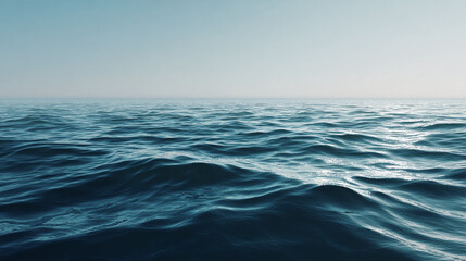 Fototapeta premium A serene view of the vast ocean under a clear sky, with gentle waves rippling across the water