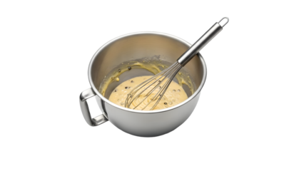 Mixing batter in a stainless steel bowl with a whisk