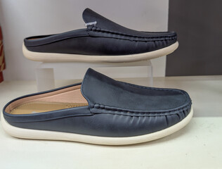 A collection of shoes displayed in a shopping store