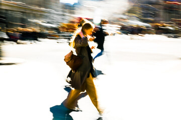 Postmodernism style, artistic motion of people with shopping bags crossing Oxford Circus junction at sunny day. London