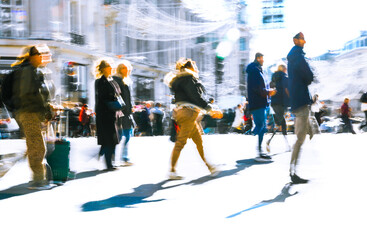 Postmodernism style, artistic motion of people with shopping bags crossing Oxford Circus junction at sunny day. London