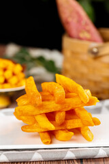 Golden Crispy French Fries Stack with Fresh Vegetables