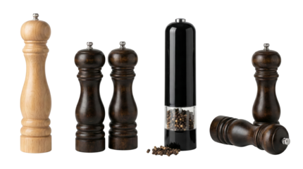 set of salt and pepper grinders with transparent pepper mill isolated on black background with