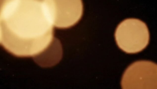 Bokeh light motion background, soft blurred circles, warm tones, gentle movement, elegant mood, seamless loop, clean background, cinematic quality